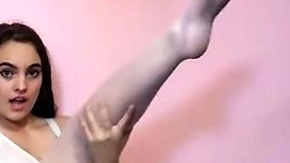 Busty Brunette's Sensual Striptease in BDSM-themed Lingerie