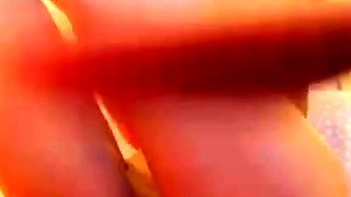 Cute amateur teen girl toying her pussy in bed on cam