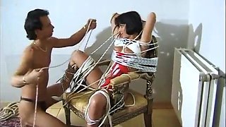 Dark-haired honey gets strapped up