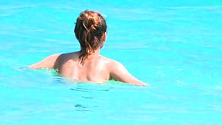 Smoothest nudist play in the warm water  at a nudist beach