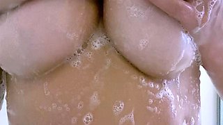 Busty curly brunette with big boobs fucks on couch