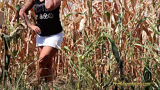 Pee in a field of corn - pissing herself while talking with her boyfriend on the phone