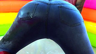 Chanel and Karma with a dildo belt in the oil pool