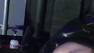 Lady Valeska and Miss Patricia have their sub over a bench.