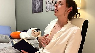 Voyeur of sexy brunette reading a hot romance novel and