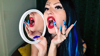 Kissing. Lip and mouth fetish. A Mistress licks and kisses a mirror while wearing bright red lipstick. Tongue fetish.