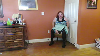 Nurse Vicki  plays with a rubber ball in a mini skirt, sexy stockings and high heel mini boots