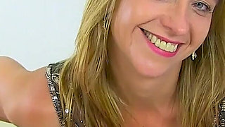 English MILF Caz Looks Amazing in a Leather Skirt and White Fishnet Tights