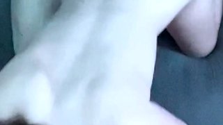 A super sexy brunette massages her big boobs