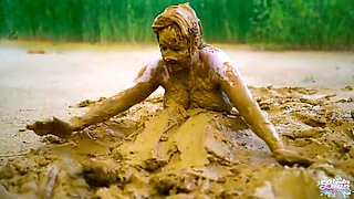 German teen masturbates to orgasm in muddy lake - wet and messy solo fingering