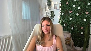 Petite blonde with big tits and ass teases on webcam
