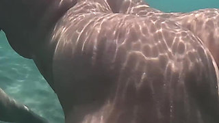 Naked MILF Swimming with Anal Plug Underwater