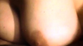 A super sexy brunette massages her big boobs