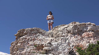 Brunette babe with nice tits is pissing by the pool