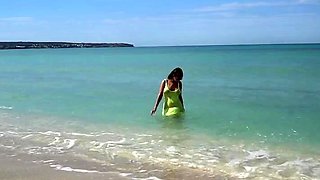 Naughty mom by the sea in see thru Yellow dress flashing