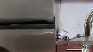 Wet in the Kitchen - Brunette Plays with the Faucet Spray on the Counter
