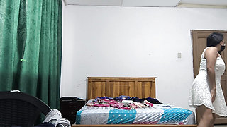 A busty, executive office worker is getting ready to go to work at the embassy. She's a beautiful lady.