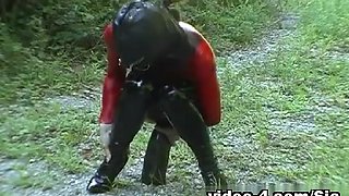 Butt toying in latex during a hike in the nature