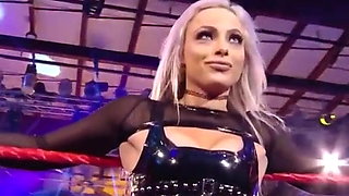 WWE - Liv Morgan posing between the ring ropes