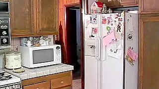 Redhead and blonde having hot kitchen fuck
