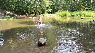 Cute Teen in Costume Playing in the River Like in a Swimming Pool