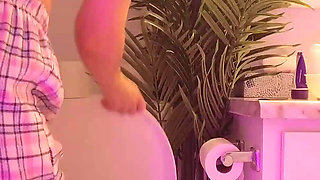 Emily pissing in the bathroom