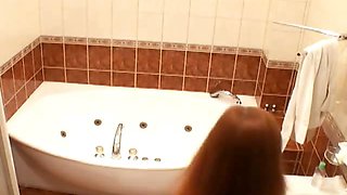 Superb busty redhead voyeur babe Atlantida taking a bath on