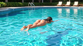 Sensual glistening wet nude curvy brunette posing on all fours by luxury pool edge in sunlight (AI generated)