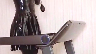 Mz24 - a Girl Bound to a Treadmill with Metal Restraints and Shackles