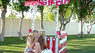 Lezzie blonde model fingers pussies by the kissing booth