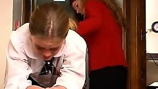 An amateur redhead lesbian is eating pussy from a brunette