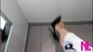 Dangling and Shoeplay in Black Pattent Pumps in a Store Closet